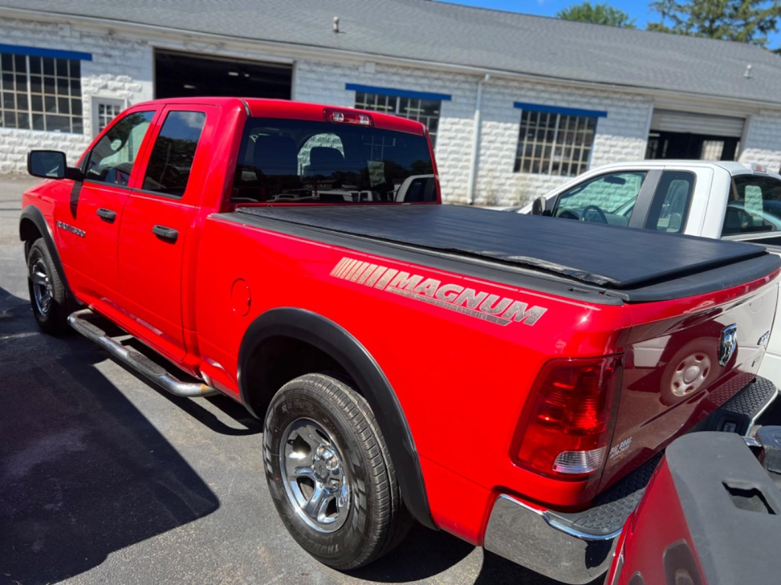 2011 Red Dodge Ram 1500 Sport Quad Cab 4WD (1D7RV1GP4BS) with an 4.7L V8 SOHC 16V FFV engine, 5-Speed Automatic transmission, located at 101 N. Main Street, Muncy, PA, 17756, (570) 546-5462, 41.207691, -76.785942 - Photo #1