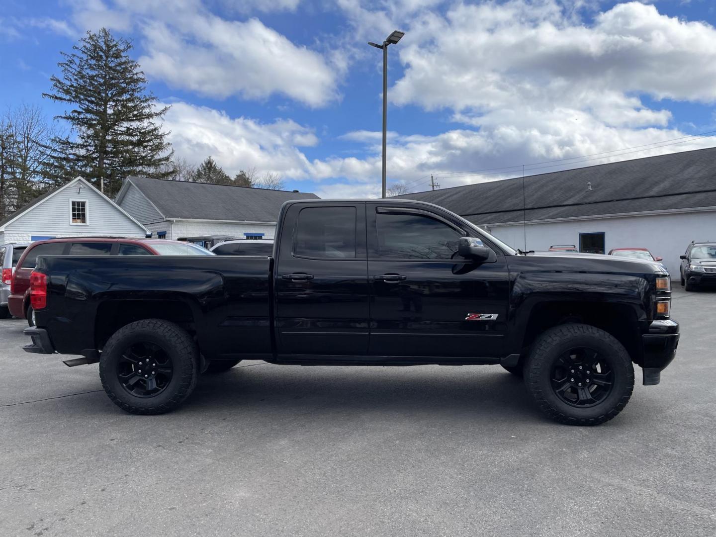 2015 black Chevrolet Silverado 1500 LT Double Cab 4WD (1GCVKREC3FZ) with an 5.3L V8 OHV 16V engine, 6-Speed Automatic transmission, located at 101 N. Main Street, Muncy, PA, 17756, (570) 546-5462, 41.207691, -76.785942 - Photo#1