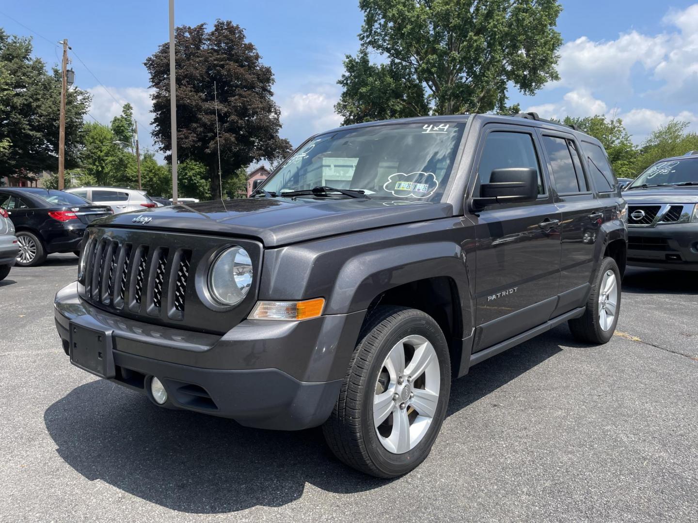 2015 Jeep Patriot Latitude 4WD (1C4NJRFB3FD) with an 2.4L L4 DOHC 16V engine, located at 101 N. Main Street, Muncy, PA, 17756, (570) 546-5462, 41.207691, -76.785942 - Photo#0