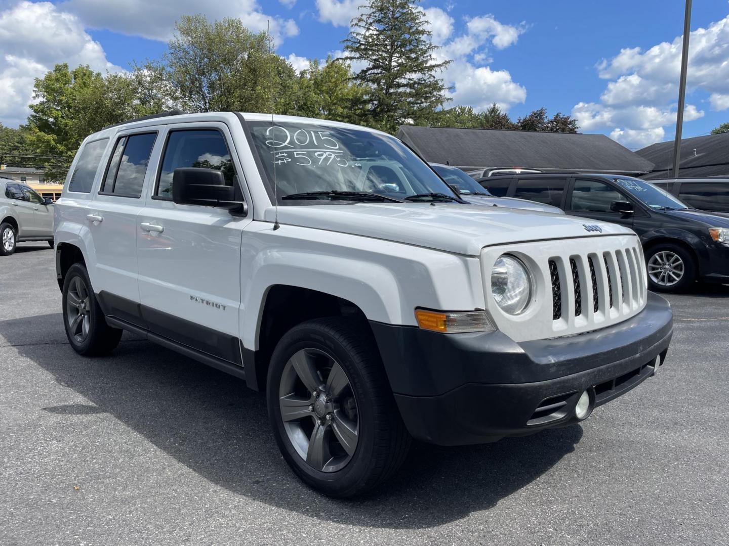2015 White /black Jeep Patriot Latitude 4WD (1C4NJRFB4FD) with an 2.4L L4 DOHC 16V engine, auto transmission, located at 101 N. Main Street, Muncy, PA, 17756, (570) 546-5462, 41.207691, -76.785942 - Photo#2