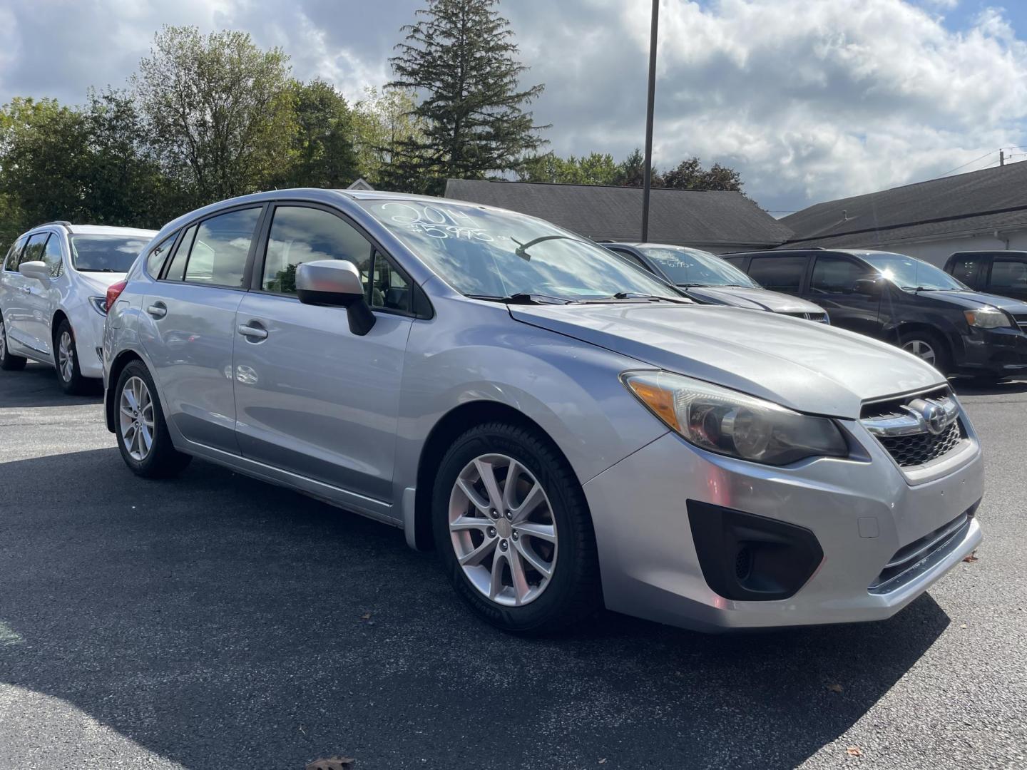 2014 silver Subaru Impreza 2.0i Premium 5-Door w/All Weather Package (JF1GPAC62E8) with an 2.0L H4 DOHC 16V engine, Continuously Variable Transmission transmission, located at 101 N. Main Street, Muncy, PA, 17756, (570) 546-5462, 41.207691, -76.785942 - Photo#1