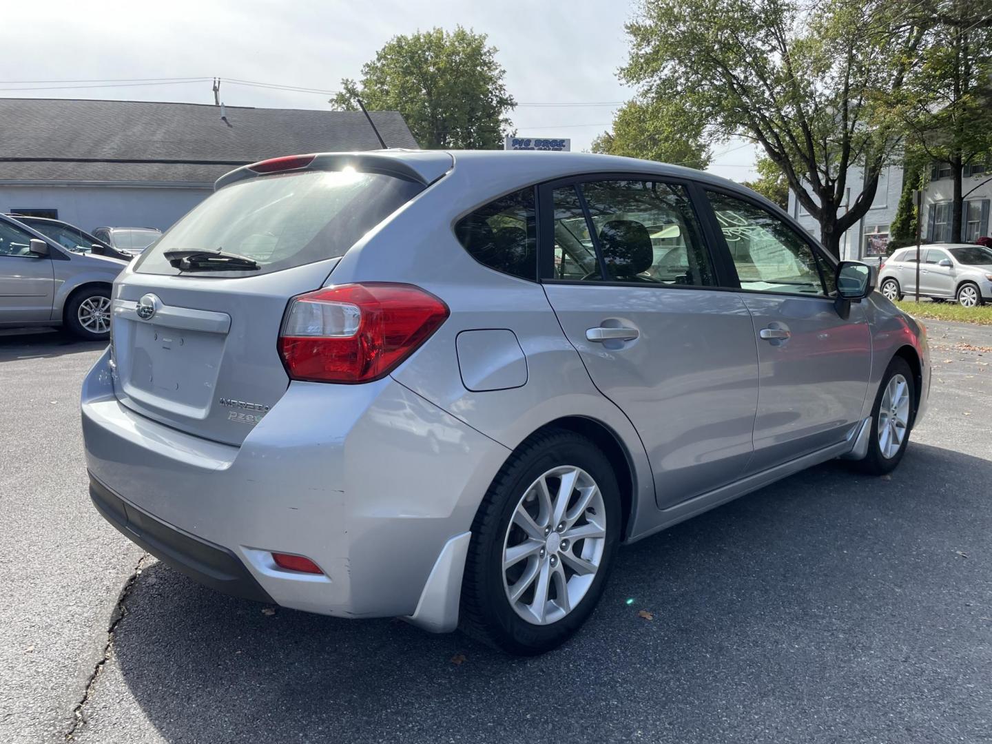 2014 silver Subaru Impreza 2.0i Premium 5-Door w/All Weather Package (JF1GPAC62E8) with an 2.0L H4 DOHC 16V engine, Continuously Variable Transmission transmission, located at 101 N. Main Street, Muncy, PA, 17756, (570) 546-5462, 41.207691, -76.785942 - Photo#2