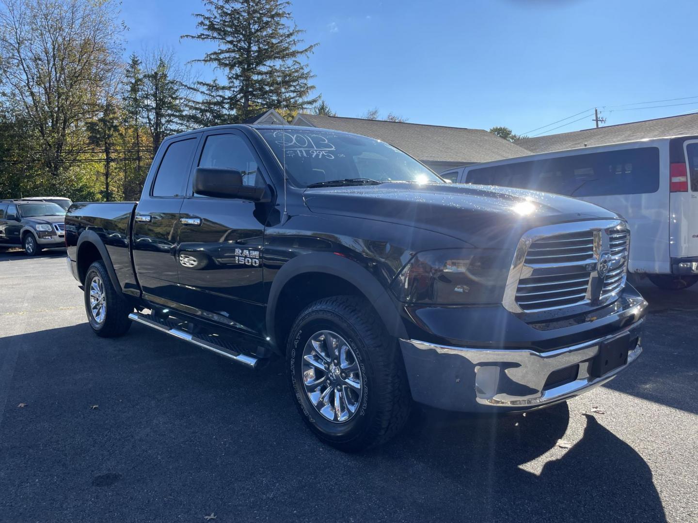 2013 black RAM 1500 SLT Quad Cab 4WD (1C6RR7GG8DS) with an 3.6L V6 DOHC 24V FFV engine, 6-Speed Automatic transmission, located at 101 N. Main Street, Muncy, PA, 17756, (570) 546-5462, 41.207691, -76.785942 - Photo#1