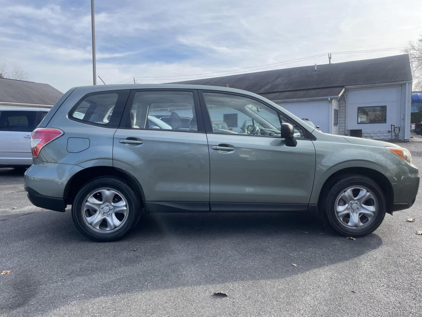 2014 Subaru Forester 2.5i (JF2SJAAC6EG) with an 2.5L H4 SOHC 16V engine, 6-Speed Manual transmission, located at 101 N. Main Street, Muncy, PA, 17756, (570) 546-5462, 41.207691, -76.785942 - Photo#4