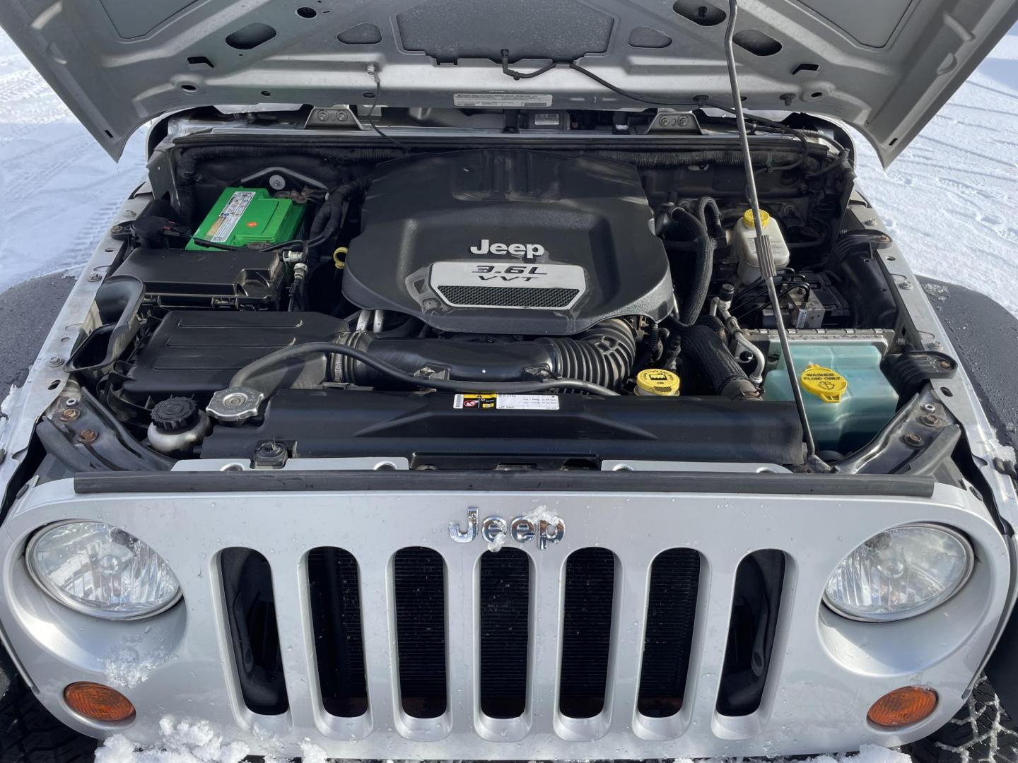 2012 Jeep Wrangler Unlimited Sport 4WD (1C4BJWDG1CL) with an 3.6L V6 DOHC 24V FFV engine, 6 speed manual transmission, located at 101 N. Main Street, Muncy, PA, 17756, (570) 546-5462, 41.207691, -76.785942 - Photo#7