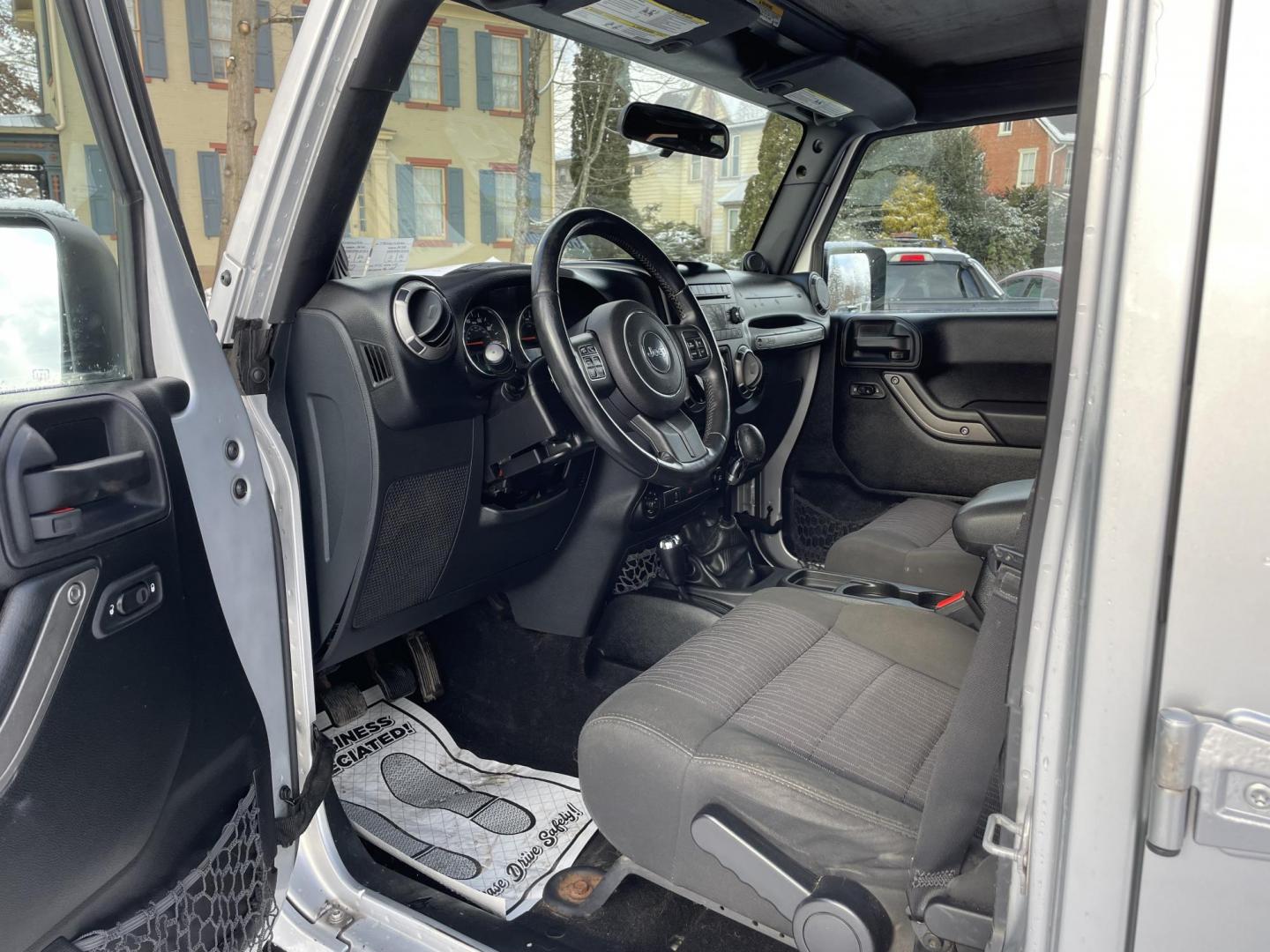2012 Jeep Wrangler Unlimited Sport 4WD (1C4BJWDG1CL) with an 3.6L V6 DOHC 24V FFV engine, 6 speed manual transmission, located at 101 N. Main Street, Muncy, PA, 17756, (570) 546-5462, 41.207691, -76.785942 - Photo#4