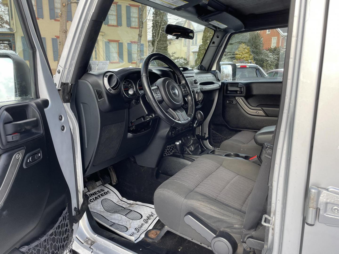 2012 Jeep Wrangler Unlimited Sport 4WD (1C4BJWDG1CL) with an 3.6L V6 DOHC 24V FFV engine, 6 speed manual transmission, located at 101 N. Main Street, Muncy, PA, 17756, (570) 546-5462, 41.207691, -76.785942 - Photo#8