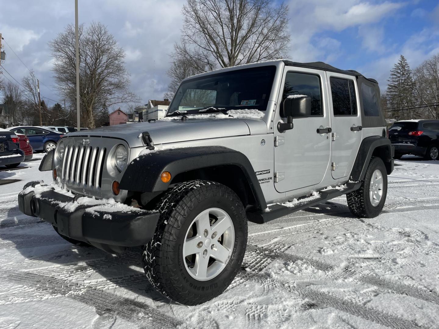2012 Jeep Wrangler Unlimited Sport 4WD (1C4BJWDG1CL) with an 3.6L V6 DOHC 24V FFV engine, 6 speed manual transmission, located at 101 N. Main Street, Muncy, PA, 17756, (570) 546-5462, 41.207691, -76.785942 - Photo#0