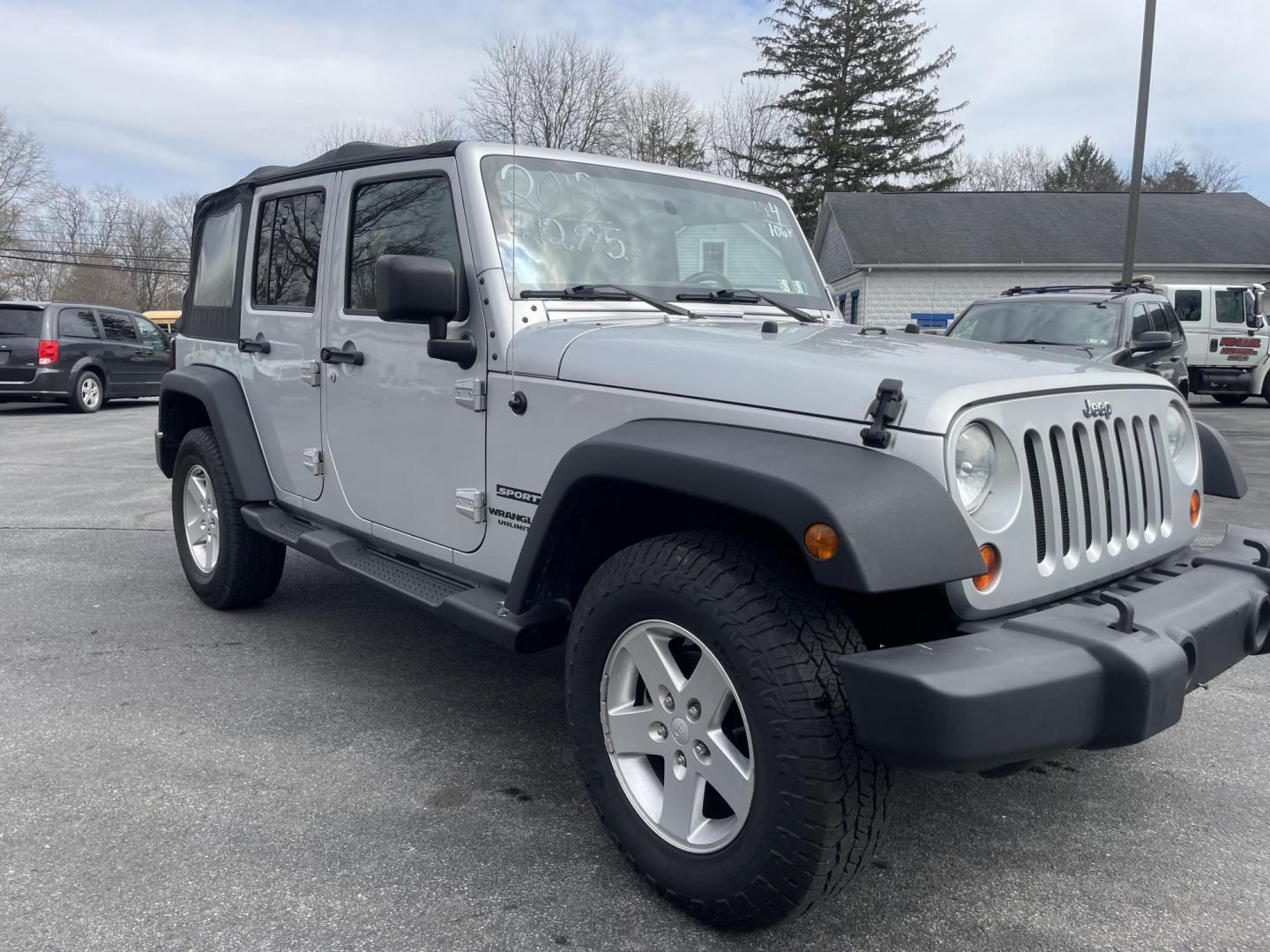 2012 Jeep Wrangler Unlimited Sport 4WD (1C4BJWDG1CL) with an 3.6L V6 DOHC 24V FFV engine, 6 speed manual transmission, located at 101 N. Main Street, Muncy, PA, 17756, (570) 546-5462, 41.207691, -76.785942 - Photo#1