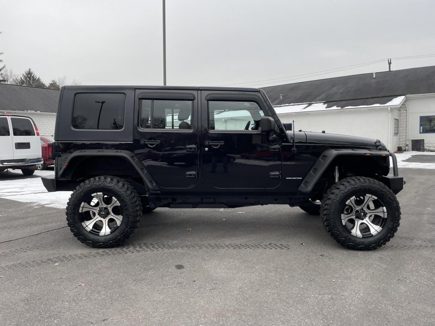 2011 black /black Jeep Wrangler Unlimited Sport 4WD (1J4BA3H1XBL) with an 3.8L V6 OHV 12V engine, located at 101 N. Main Street, Muncy, PA, 17756, (570) 546-5462, 41.207691, -76.785942 - Photo#4