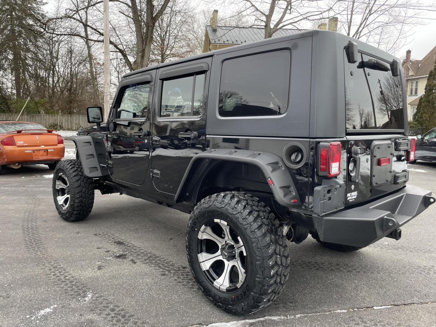 2011 black /black Jeep Wrangler Unlimited Sport 4WD (1J4BA3H1XBL) with an 3.8L V6 OHV 12V engine, located at 101 N. Main Street, Muncy, PA, 17756, (570) 546-5462, 41.207691, -76.785942 - Photo#3