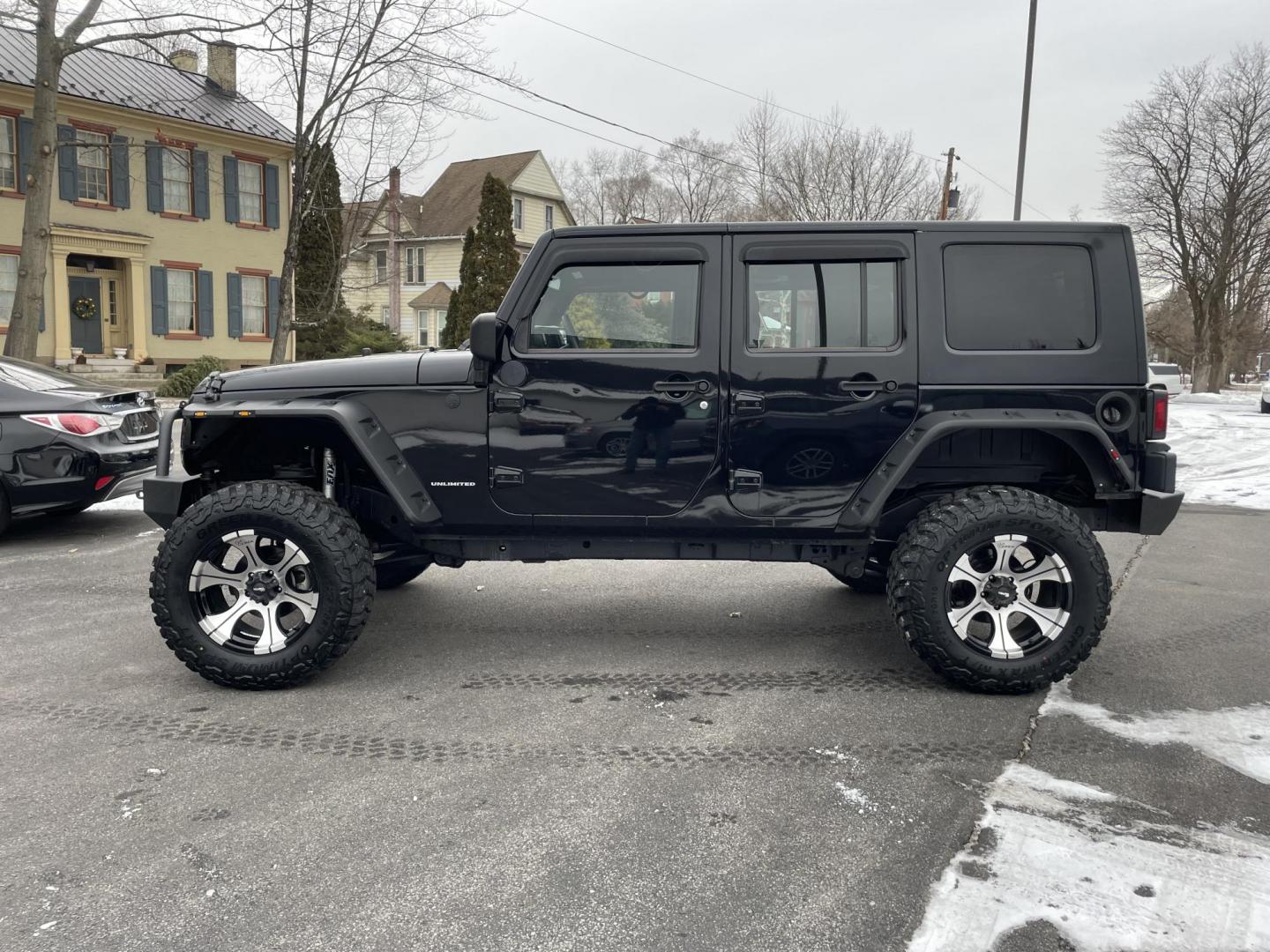 2011 black /black Jeep Wrangler Unlimited Sport 4WD (1J4BA3H1XBL) with an 3.8L V6 OHV 12V engine, located at 101 N. Main Street, Muncy, PA, 17756, (570) 546-5462, 41.207691, -76.785942 - Photo#2