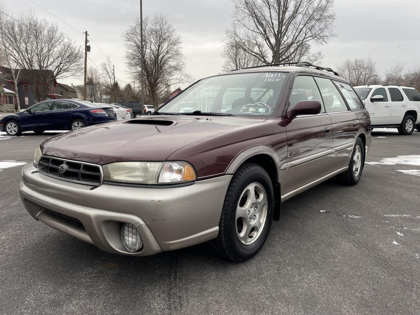 1999 burgandy Subaru Legacy Wagon Outback (4S3BG6851X7) with an 2.5L H4 DOHC 16V engine, 4-Speed Automatic Overdrive transmission, located at 101 N. Main Street, Muncy, PA, 17756, (570) 546-5462, 41.207691, -76.785942 - Photo#0