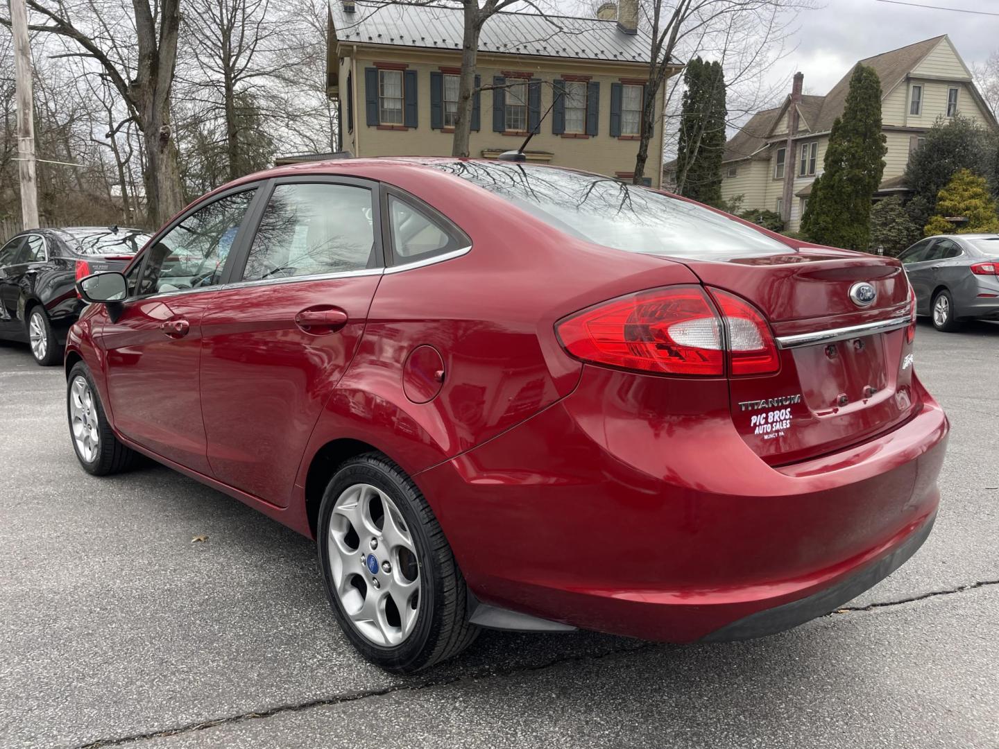 2013 burgandy Ford Fiesta Titanium Sedan (3FADP4CJ6DM) with an 1.6L L4 DOHC 16V engine, located at 101 N. Main Street, Muncy, PA, 17756, (570) 546-5462, 41.207691, -76.785942 - Photo#3