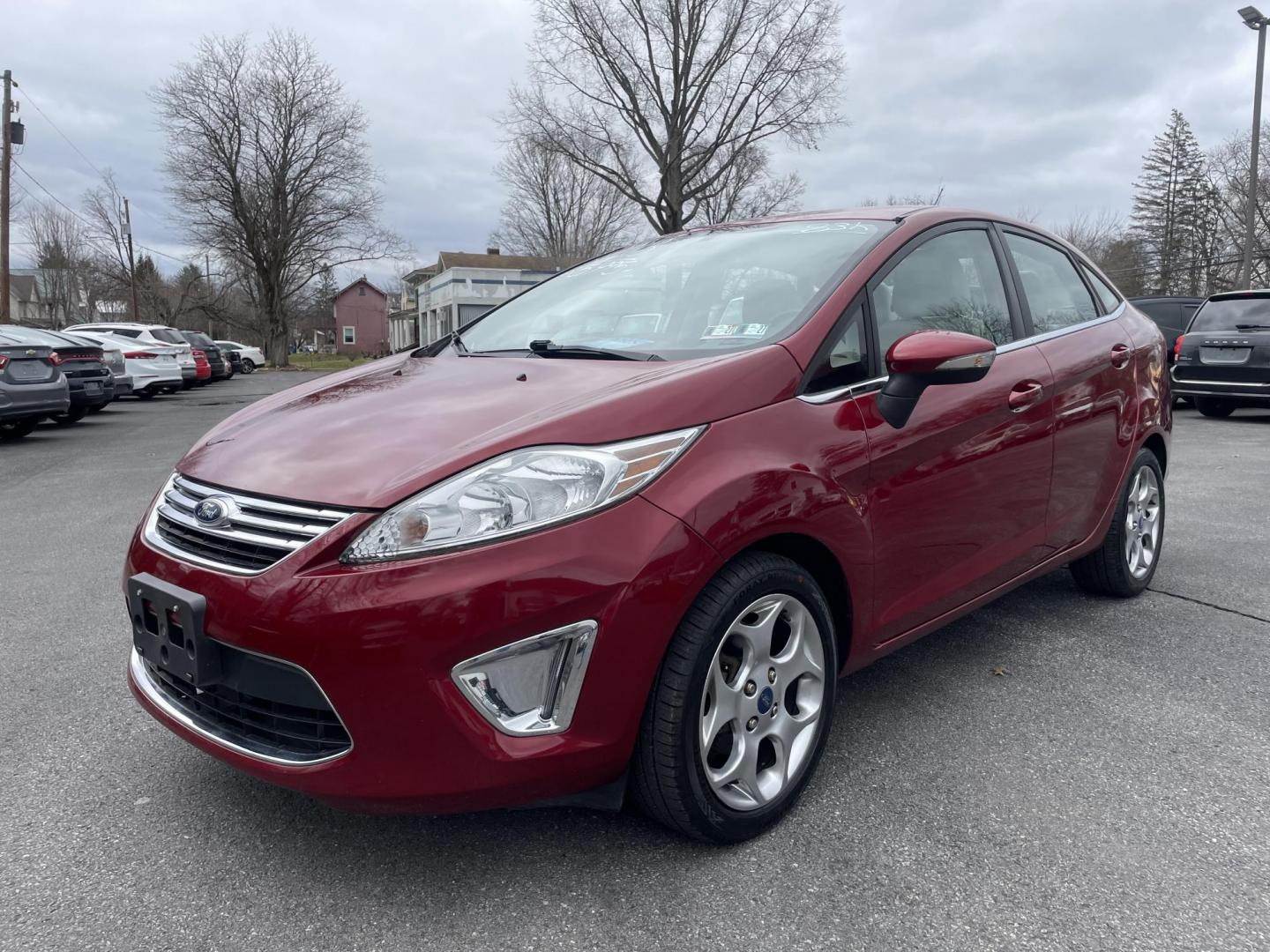 2013 burgandy Ford Fiesta Titanium Sedan (3FADP4CJ6DM) with an 1.6L L4 DOHC 16V engine, located at 101 N. Main Street, Muncy, PA, 17756, (570) 546-5462, 41.207691, -76.785942 - Photo#1
