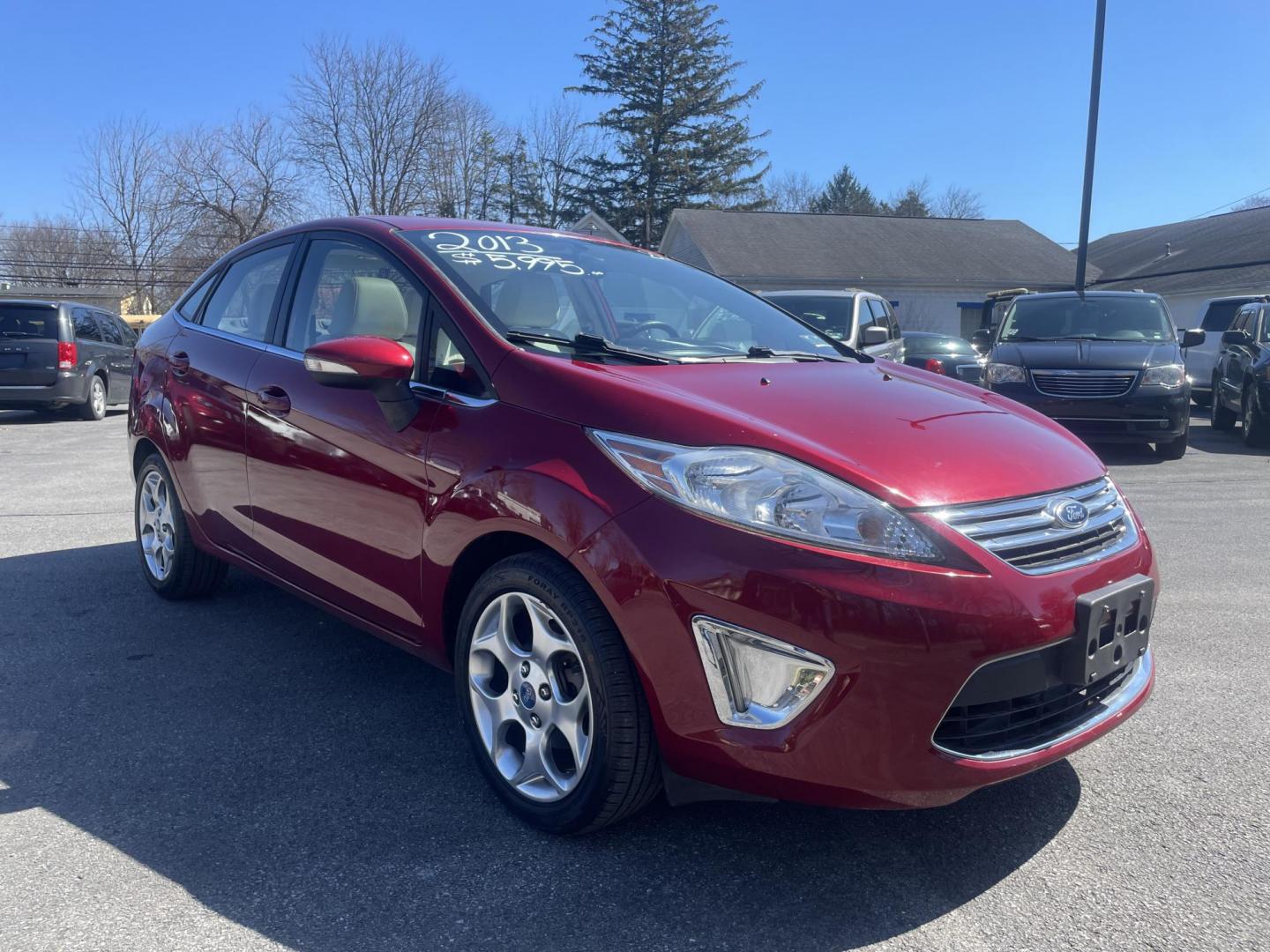 2013 burgandy Ford Fiesta Titanium Sedan (3FADP4CJ6DM) with an 1.6L L4 DOHC 16V engine, located at 101 N. Main Street, Muncy, PA, 17756, (570) 546-5462, 41.207691, -76.785942 - Photo#1