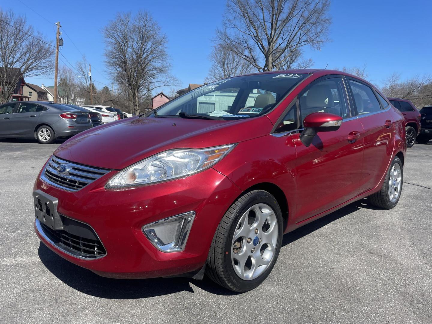 2013 burgandy Ford Fiesta Titanium Sedan (3FADP4CJ6DM) with an 1.6L L4 DOHC 16V engine, located at 101 N. Main Street, Muncy, PA, 17756, (570) 546-5462, 41.207691, -76.785942 - Photo#0