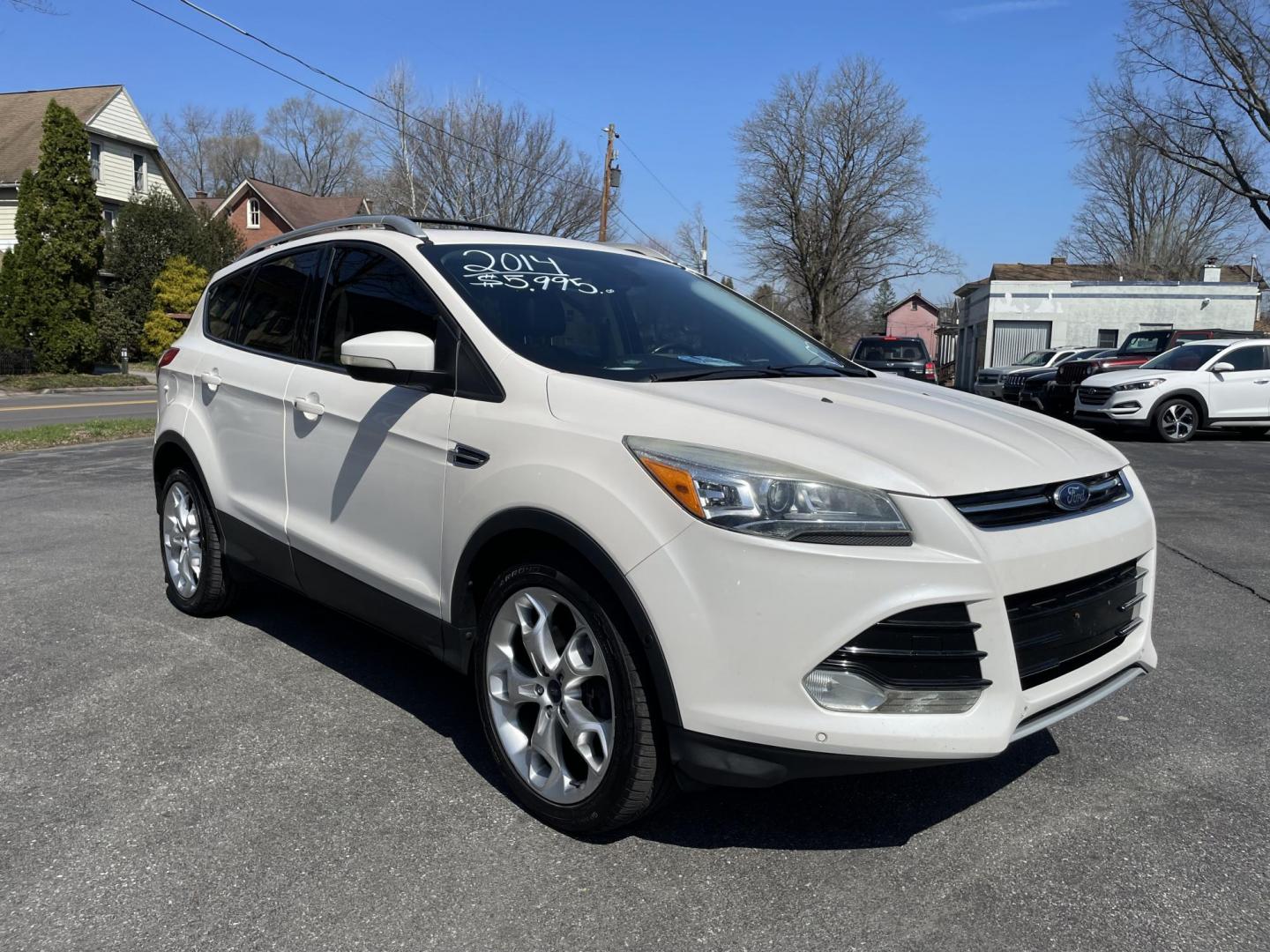 2014 White /black Ford Escape Titanium 4WD (1FMCU9J92EU) with an 2.0L L4 DOHC 16V engine, 6-Speed Automatic transmission, located at 101 N. Main Street, Muncy, PA, 17756, (570) 546-5462, 41.207691, -76.785942 - Photo#1