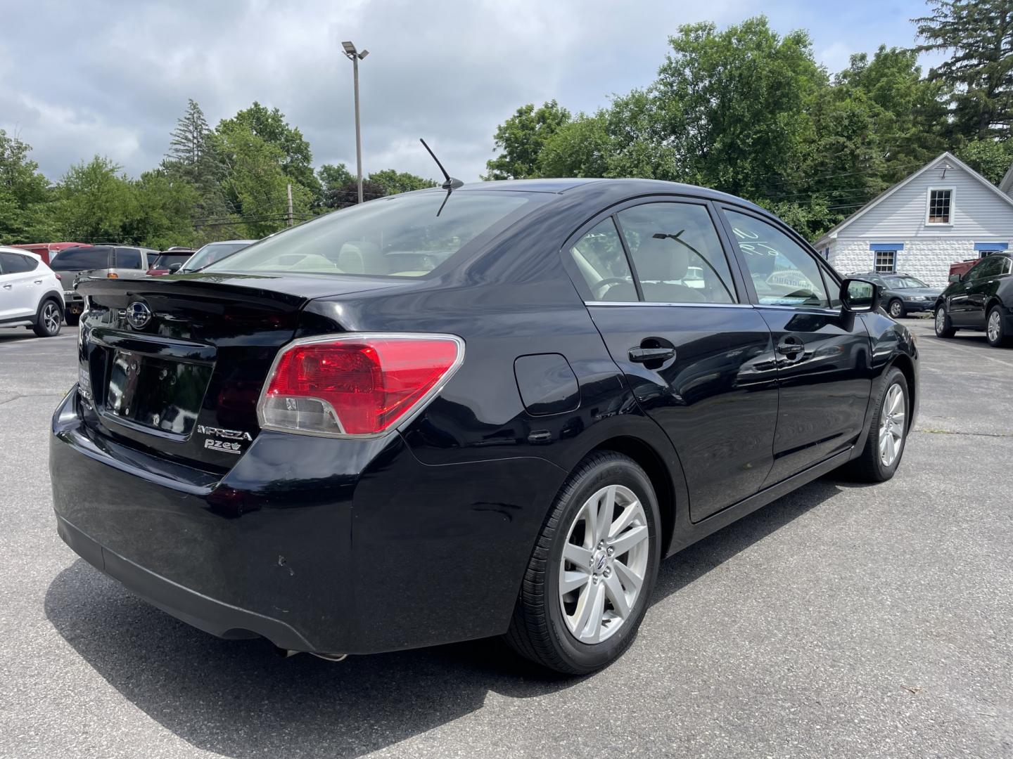 2015 Subaru Impreza 2.0i Premium PZEV 4-Door (JF1GJAC61FH) with an 2.0L H4 DOHC 16V engine, CVT transmission, located at 101 N. Main Street, Muncy, PA, 17756, (570) 546-5462, 41.207691, -76.785942- Photo#2