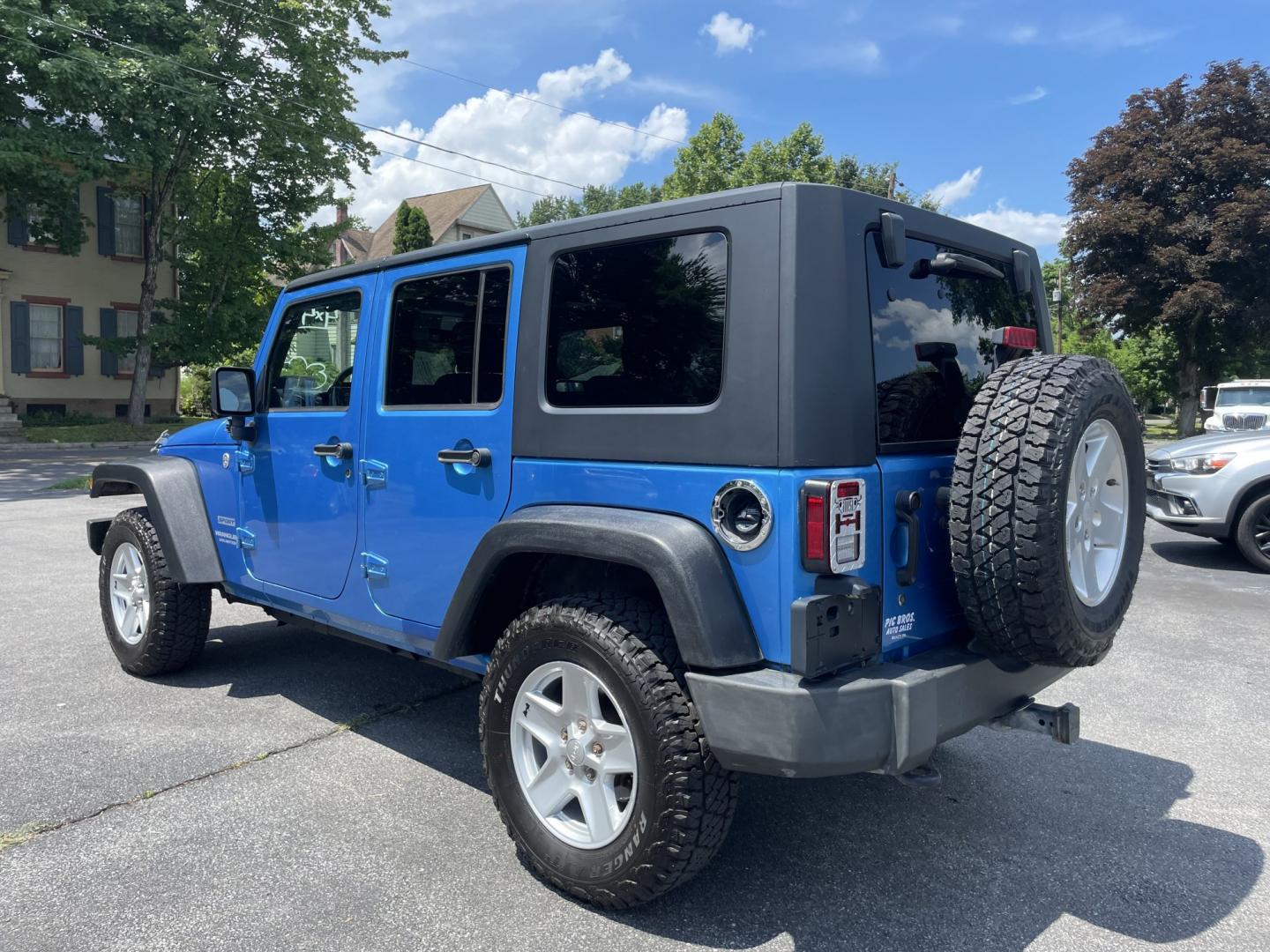 2010 Jeep Wrangler Unlimited Sport 4WD (1J4BA3H11AL) with an 3.8L V6 OHV 12V engine, located at 101 N. Main Street, Muncy, PA, 17756, (570) 546-5462, 41.207691, -76.785942- Photo#2