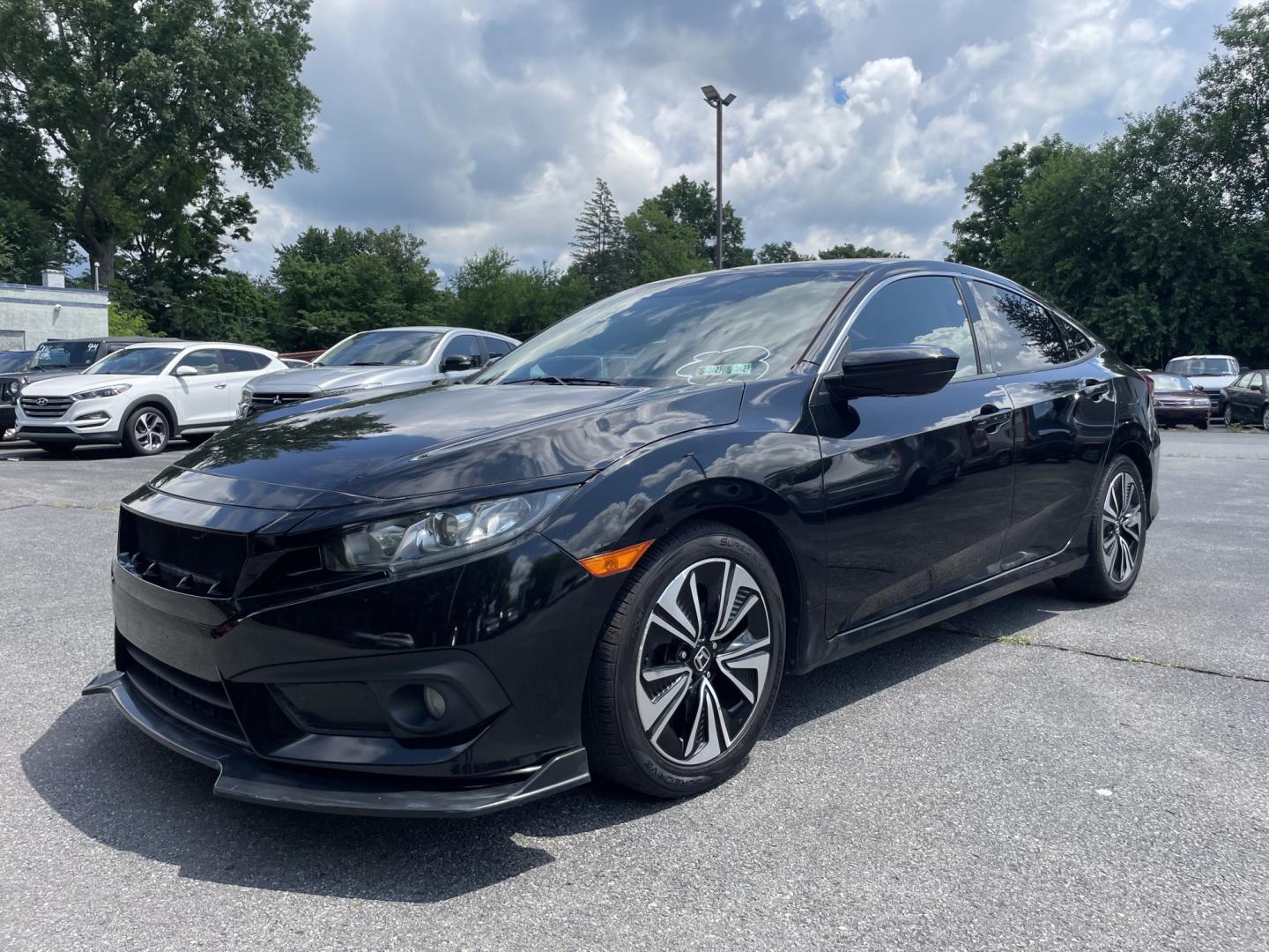 2016 Honda Civic EX-T Honda Sensing Sedan CVT (2HGFC1F42GH) with an 1.5L L4 DOHC 16V TURBO engine, CVT transmission, located at 101 N. Main Street, Muncy, PA, 17756, (570) 546-5462, 41.207691, -76.785942- Photo#0